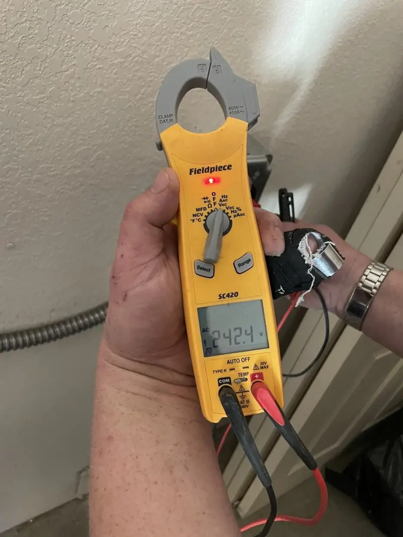 Voltage testing with clamp meter during Ceiling Fan Installation in Crofton